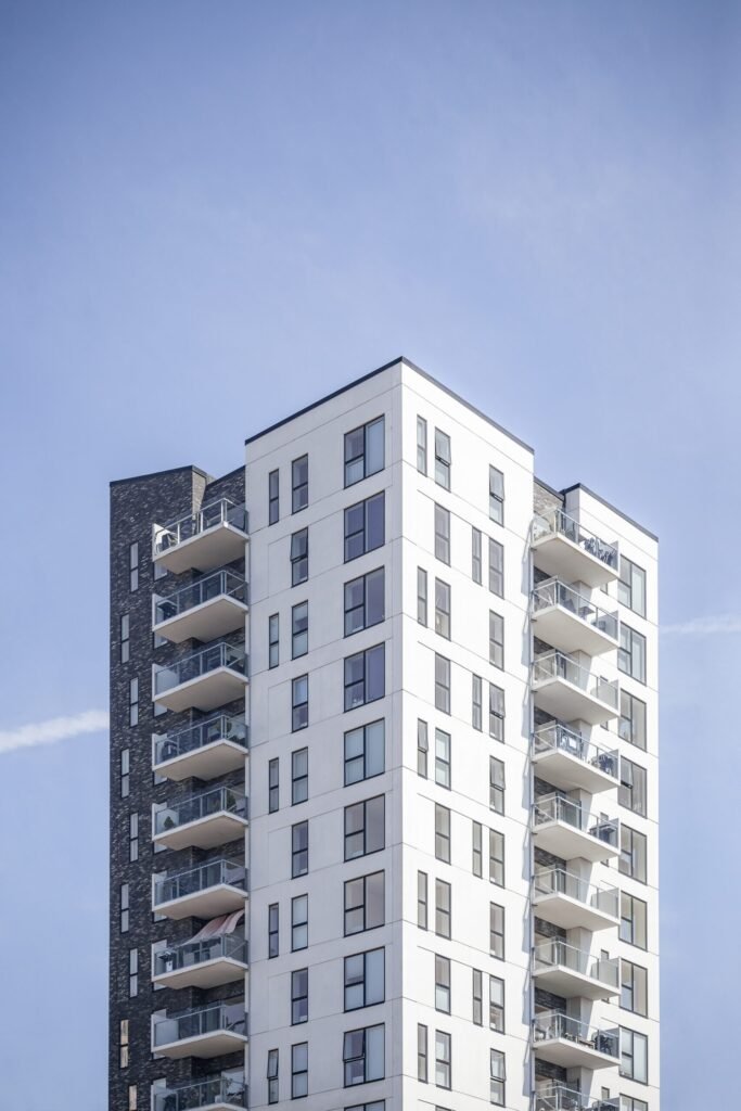vertical shot of a white building under the clear sky